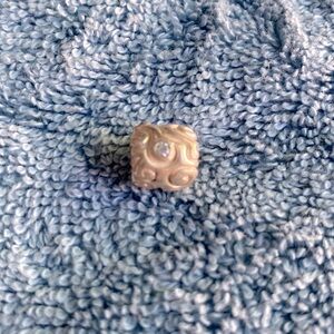 Pandora sterling charm. Swirl design with CZ’s.